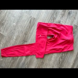 Bright pink Lululemon running leggings